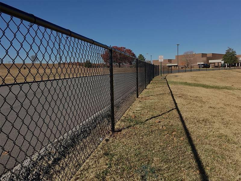 Galvanized chain-link fence, installed in towns surrounding Inverness